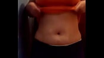 A gorgeous girl takes off her clothes.