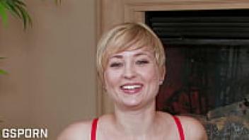 During a masturbation, the attractive blonde Nora Skyy displays her hairy pussy.
