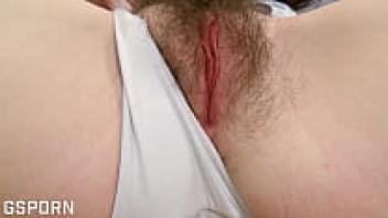 An 18-year-old brunette athlete naturally masturbates her hairy pussy.