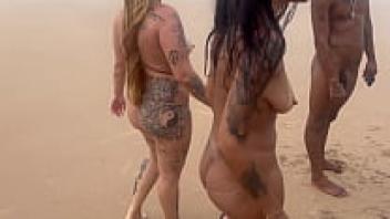 Friends enjoy taking in the beauty of the beach.
