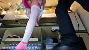 Sexy brunette showing her upskirt while trying on new shoes for work