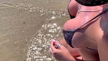 On a public beach, blonde beauty Kelley Cabbana is infatuated.