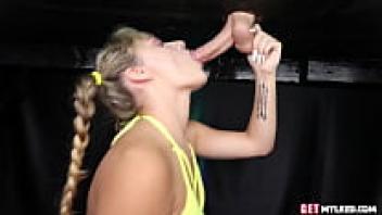 Teenage babe in a bikini eating cock from beneath a table