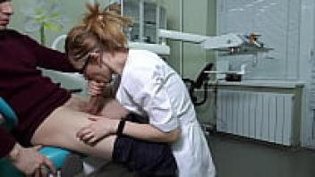 A woman wearing glasses, a Ukrainian doctor, grabbed the patient's cock and gave him a brutal blowjob and handjob out of greed.