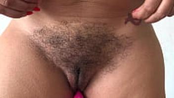 A close-up of a hairy pussy is shown by a French amateur stepmother.