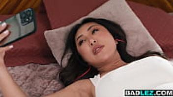 A curvaceous Asian beauty makes a Chinese roomie squirt by masturbating her large ass.