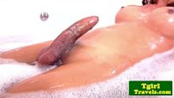After taking a bath, the amateur ladyboy wanks off.