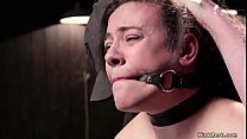 Caned in bondage, shaved twat chick