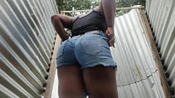 An amateur camera at a beachside changing room (ass)