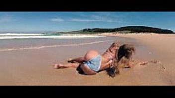 Ferrol is the travel show driver. Sasha Bikeyeva on a stunning beach in Doninos, Spain, in a bikini