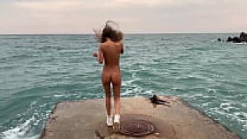 Nude Monika Fox Strolls Along Sochi's Beach