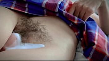 Teenage closeup of a large, hairy, oozing pussy upskirt