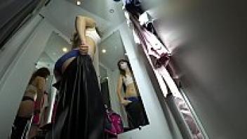 peeking into the public dressing room, a concealed camera, and a view of a lovely female with long legs and a delicious ass from below.