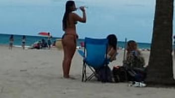 Babes getting their cocks hard on the beach