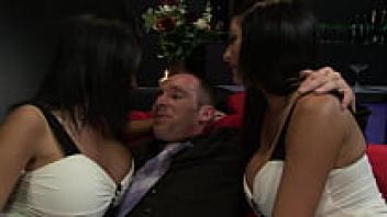 Kit and Kat Lee, the busty twins, strip down to have a horny client plough them.