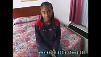 A young, black, ebony teen in a black hardcore pornographic video