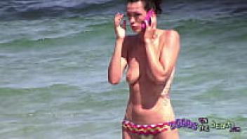 Skinny German MILF getting upset over her phone sex has a large tattoo on her back.