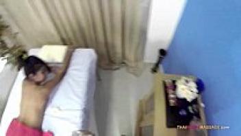 A slender Oriental lets the masseuse explore her nude body.