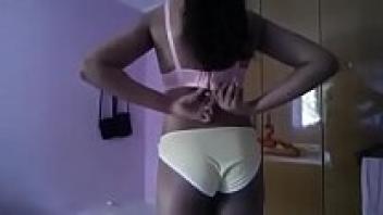 In class, a teenage girl flashes her clothes and boobs without a bra.