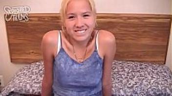 A blonde teen in her twenties rubs her pussy on a thick dick.